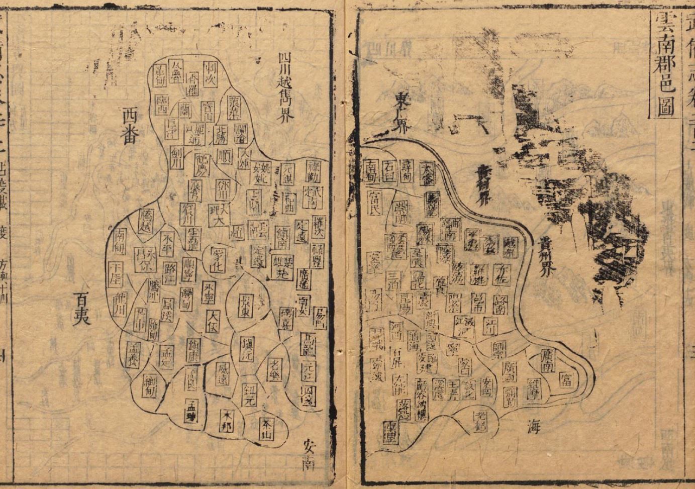 The image shows an old book with Chinese writing on it, depicting a map of a city. The map is...