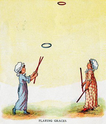 The image shows two children playing with a hula hoop, each holding a stick in their hands. At the...