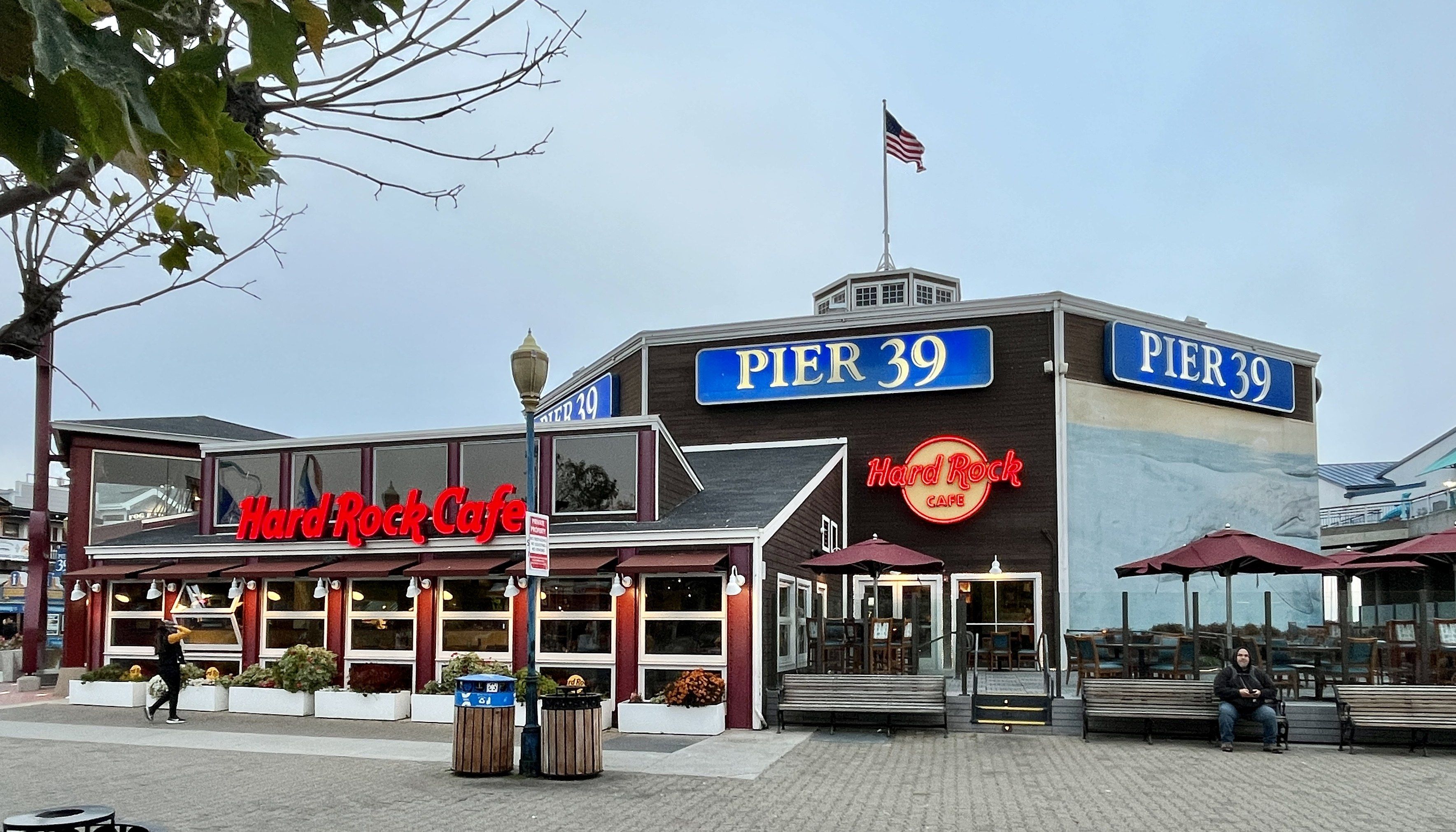 The image shows a pier 39 restaurant on the boardwalk in Atlantic City, New Jersey. There are...