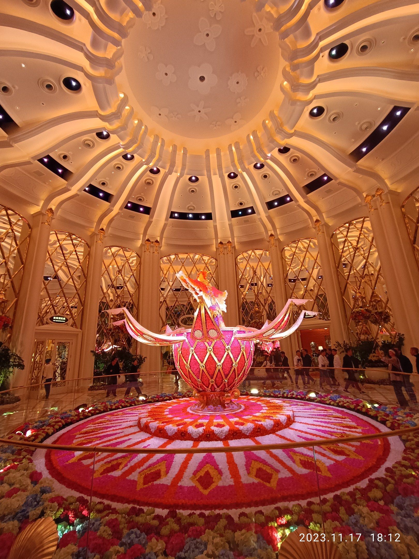 The image shows the inside of the Bellagio Hotel and Casino in Las Vegas, Nevada. There are a few...