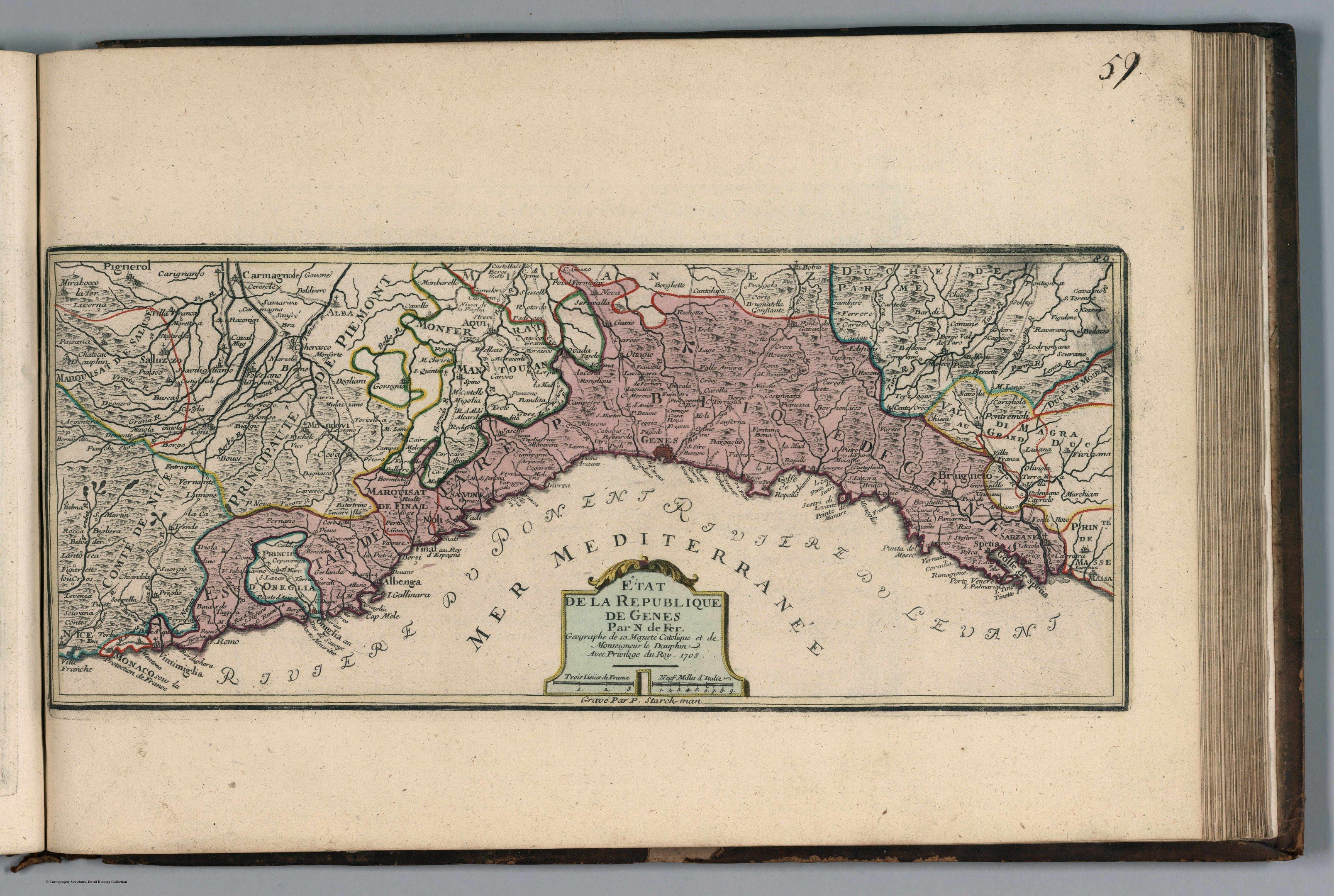 The image shows an open book with a map of Italy on it. The map is detailed and shows the various...