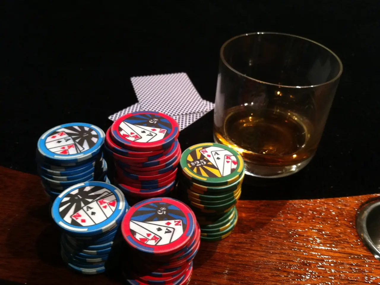 At the bottom of the image there is a wooden surface with coins. On the wooden surface there is a...