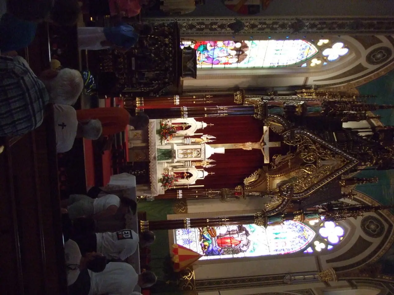 This is an inner view of the church where we can see there is a cross with Jesus sculpture on it,...