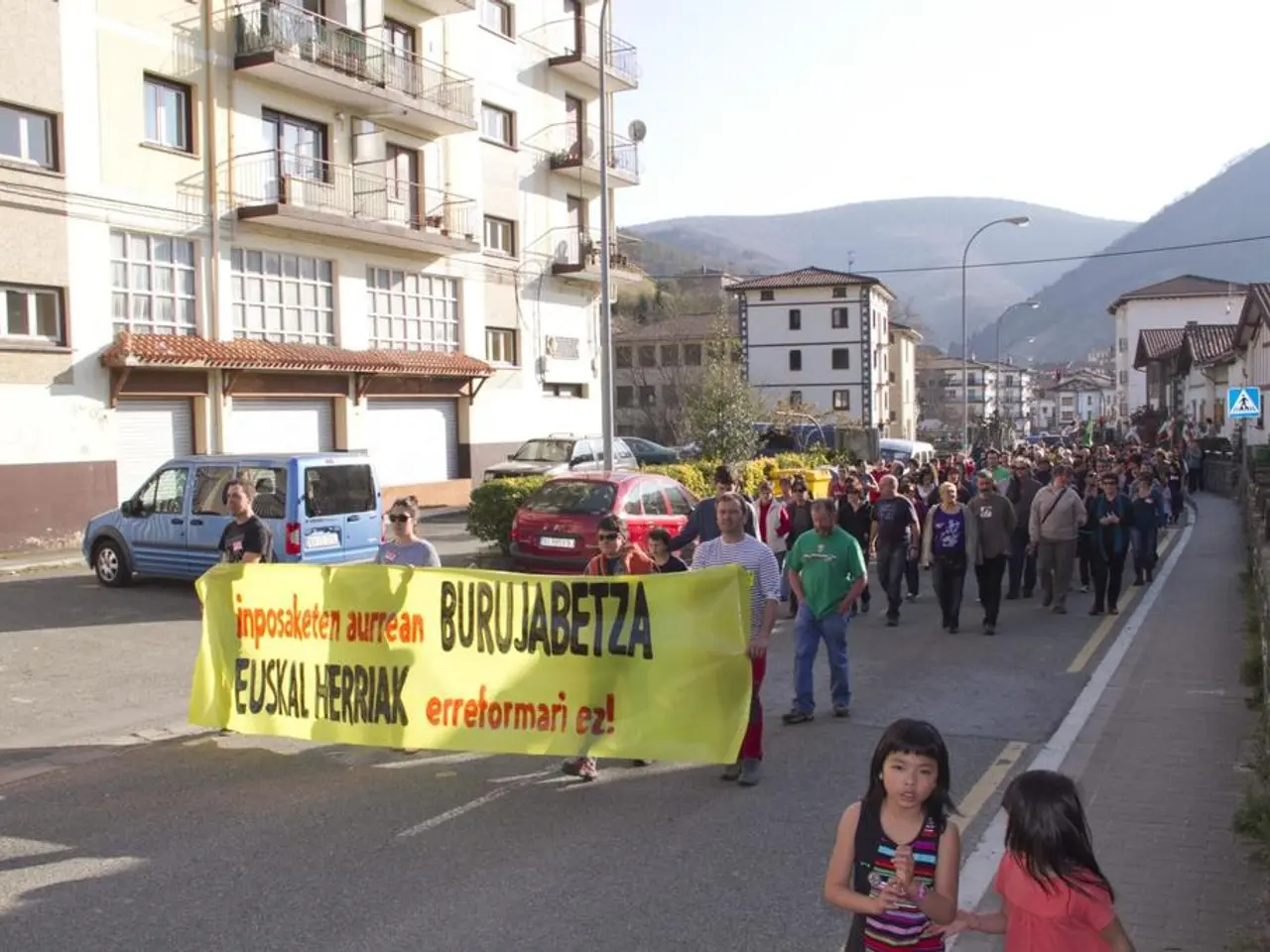 This picture is clicked outside the city. At the bottom, we see the road and two girls are...