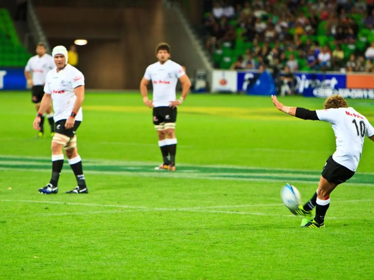 A picture is taken inside a playground. In the image there are four people playing a game. In...