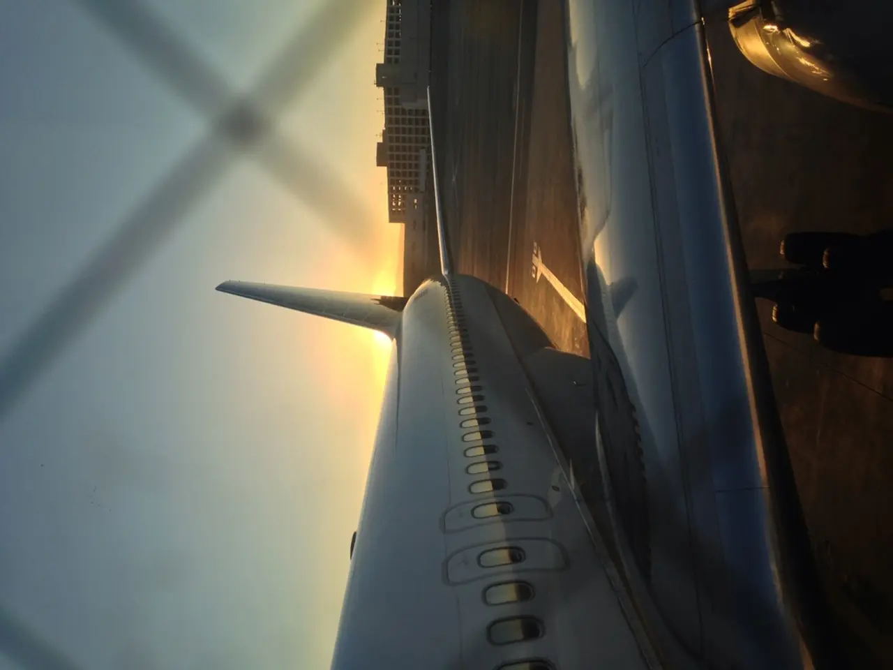 There is a flight with windows. In the back there are buildings and sky.