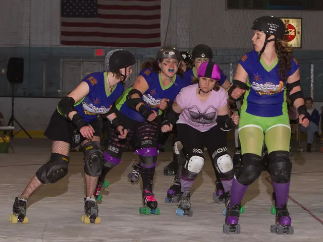 In this image there are few ladies wearing skating shoes and helmets. In the background there is...