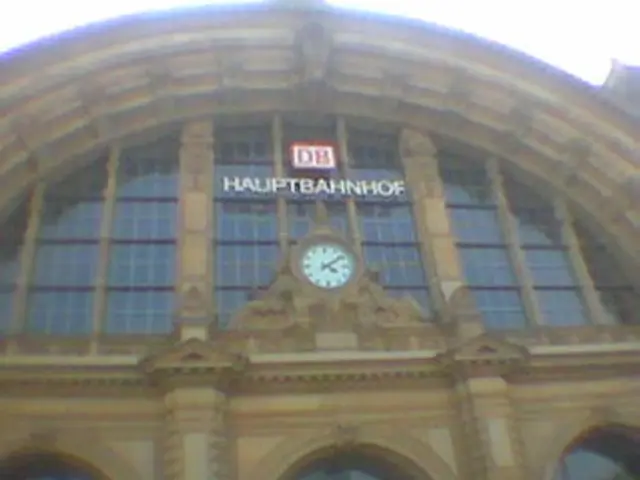 In this picture we can see the building and clock is attached to the building.