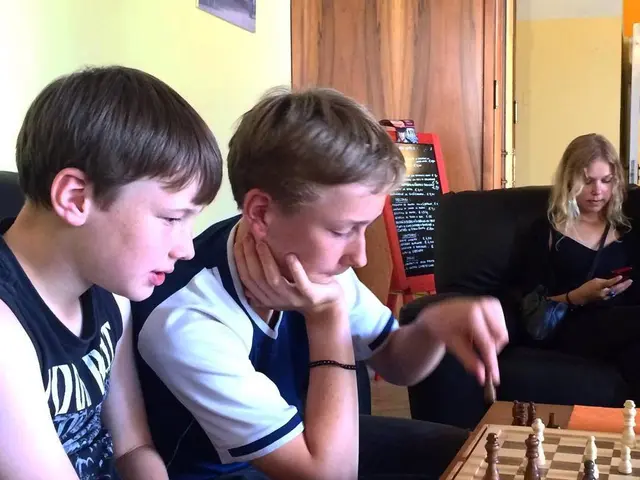 We have three people in the picture where two among them are playing the chess and the other lady...