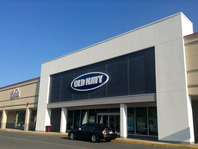 In this image there is a building, pillars, boards, people, card, bin, sky and objects. Something...
