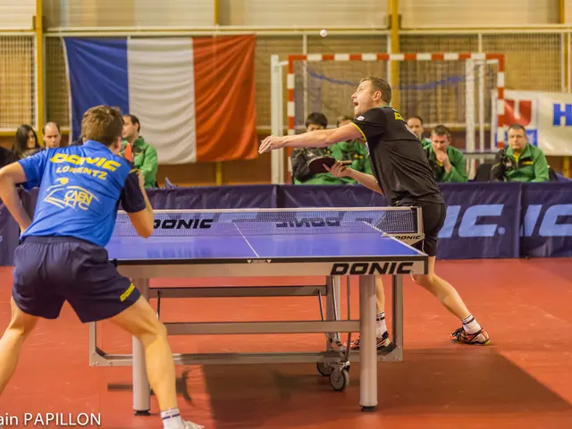 This is a table tennis. These 2 persons are standing and holding a racket. These persons are...