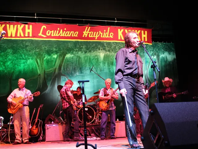 In the image we can see there are people who are standing and holding guitar in their hands.