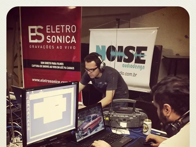 On this table there is a monitor, laptops, printer, keyboard, mouse, and, headset, device and...