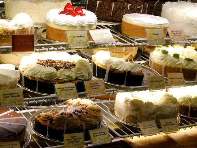 In this image, we can see there are cakes and cards arranged on the shelves.