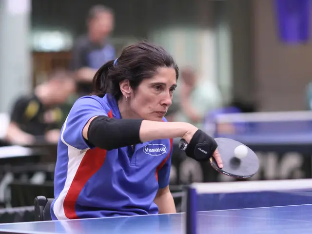 Here we can see a woman is holding a racket in her hands, and playing with the ball, and here is...