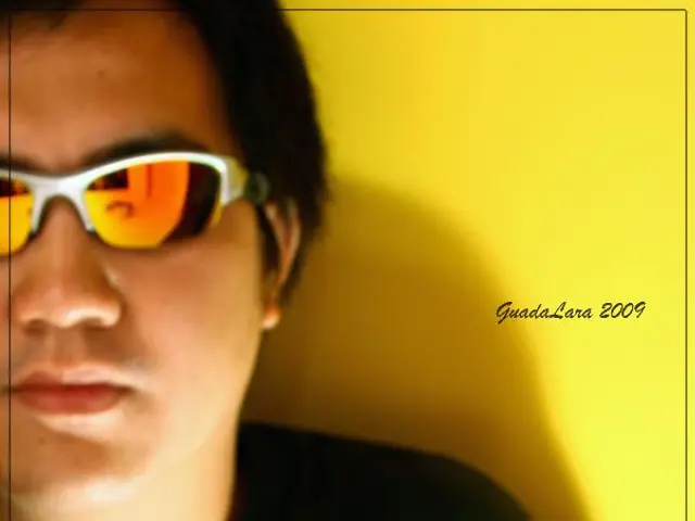 In this image in the center there is a man. In the front there is a google which is on the surface...