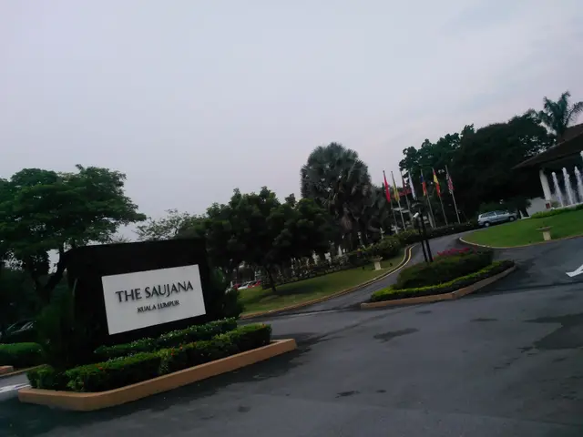 The image shows the entrance to the saujana hotel in Kuala Lumpur, Malaysia. We can see a name...
