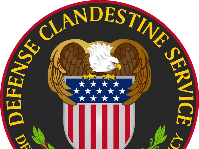 The image shows the logo of the Defense Clandestine Service, which consists of a shield with a bald...