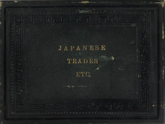 The image shows a black book with the words "Japanese Trades, Inc." written on it against a white...