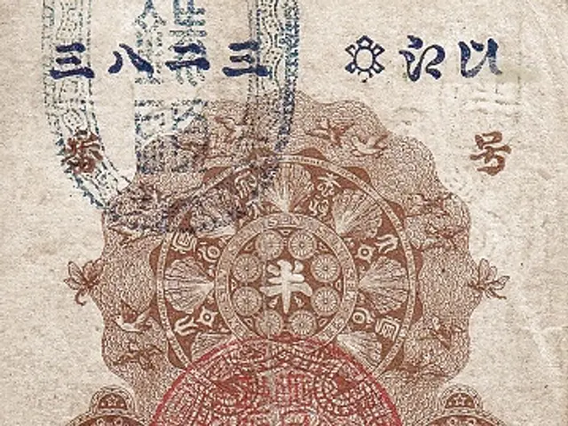 The image shows an old Japanese banknote with a red and blue design on it. The design is intricate...