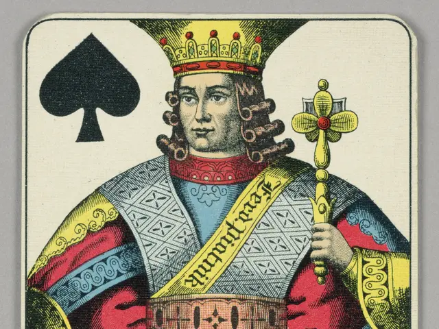 The image shows a playing card with a king of spades on it. The card is placed on a flat surface...