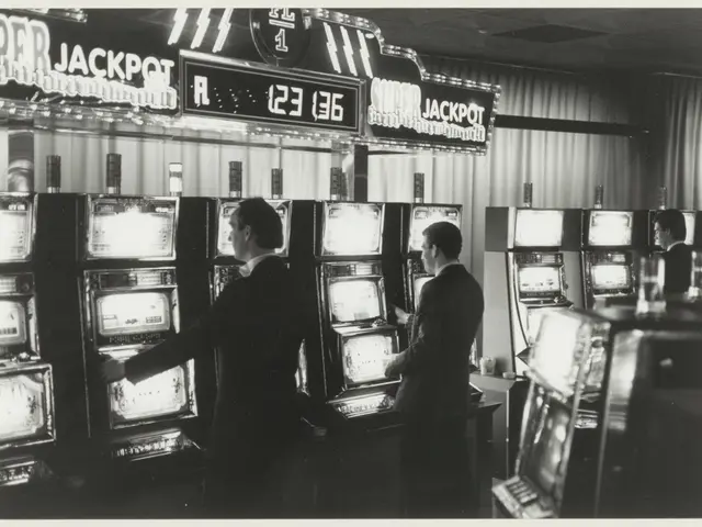 The image shows a black and white photo of two men playing slot machines in a casino. The men are...