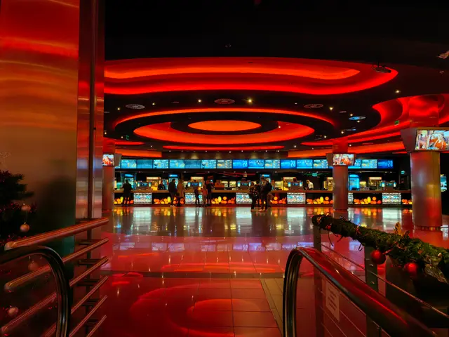 The image shows the inside of a casino with a Christmas tree in the middle of it. The floor is...