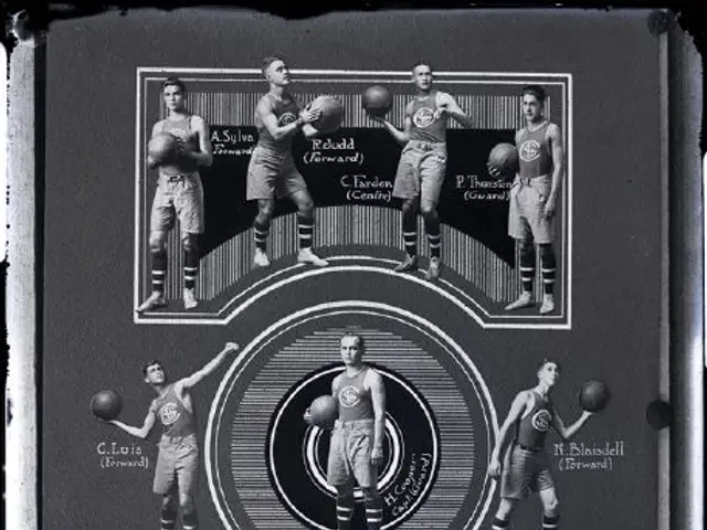 The image shows a black and white photo of a group of men standing next to each other, each holding...