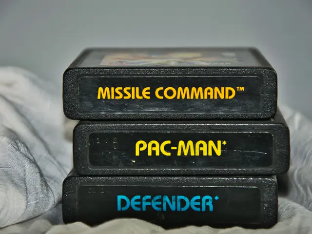 The image shows two black boxes with the words "Missile Command" and "Pac-Man Defender" written on...