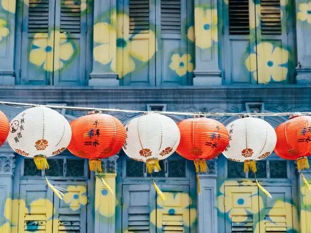 The image shows a building in Chinatown, Singapore, with colorful Chinese lanterns hanging from the...