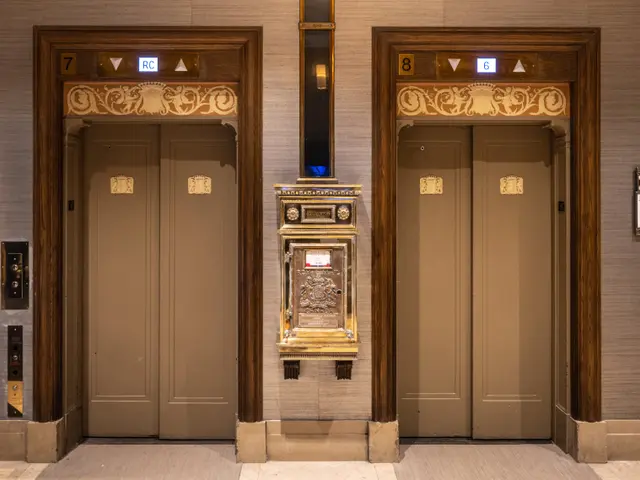 The image shows two elevators in a building with a clock on the wall. On the right side of the...