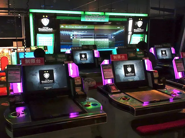 The image shows a group of people playing video games in a room with a wall in the background, a...