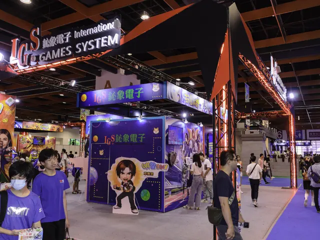 The image shows a group of people walking through a convention hall, some of them carrying bags and...