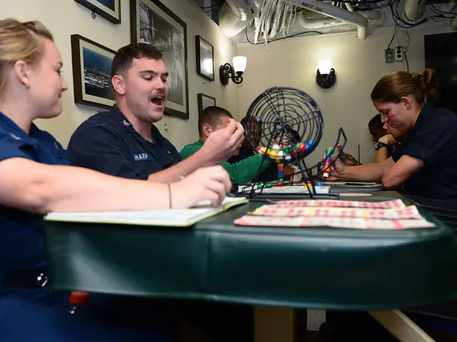 The image shows a group of people sitting around a table playing a game of bingo. On the table...