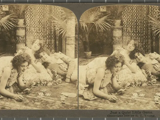 The image shows a group of women laying on the ground playing cards, surrounded by plants in pots,...